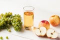 Fresh grape fruits with green leaves isolated on white background. bunch of green grapes and juice in the glass, pitcher Royalty Free Stock Photo