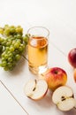 Fresh grape fruits with green leaves isolated on white background. bunch of green grapes and juice in the glass, pitcher Royalty Free Stock Photo