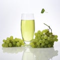 Fresh grape juice in glass with bunches of grapes Royalty Free Stock Photo