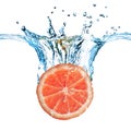 Fresh grapefruit dropped into water