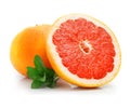 Fresh grapefruit fruit with cut and green leaves