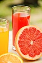 Fresh grapefruit and orange juice. Vitamins for health. Royalty Free Stock Photo