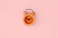 Fresh grapefruit slice in small orange alarm clock Royalty Free Stock Photo