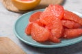 Fresh grapefruit slices in a wooden bowl, healthy snack Royalty Free Stock Photo