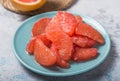 Fresh grapefruit slices in a wooden bowl, healthy snack Royalty Free Stock Photo