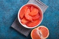 Fresh grapefruit slices in a wooden bowl, healthy snack Royalty Free Stock Photo