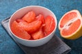 Fresh grapefruit slices in a wooden bowl, healthy snack Royalty Free Stock Photo