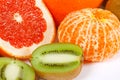 Fresh grapefruit, tangerine and kiwi closeup