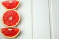 Fresh grapefruit on white boards, food wooden background, orange, citrus, frui, place for text