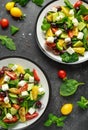 Fresh Greek salad with cucumber, cherry tomato, lettuce, red onion, feta cheese and black olives. Healthy food Royalty Free Stock Photo