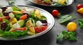 Fresh Greek salad with cucumber, cherry tomato, lettuce, red onion, feta cheese and black olives. Healthy food Royalty Free Stock Photo