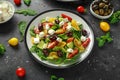 Fresh Greek salad with cucumber, cherry tomato, lettuce, red onion, feta cheese and black olives. Healthy food Royalty Free Stock Photo