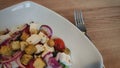 Fresh Greek salad with tasty tomatos, onion, olives, cucumber. As toping feta and croutons Royalty Free Stock Photo