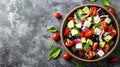 Fresh greek salad with tomato, cucumber, bel pepper , olives and feta cheese on black plate Royalty Free Stock Photo