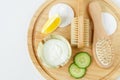 Fresh greek yogurt, lemon and cucumber slices, wooden hair brush, cotton pads, massage body brush.