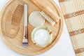 Fresh greek yogurt, make-up brush, loofah sponge, wooden hair comb and body brush. Ingredients for preparing homemade mask. Royalty Free Stock Photo