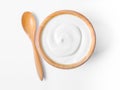 The Fresh greek yogurt in wooden bowl with wooden spoon on white background. Healthy breakfast Royalty Free Stock Photo