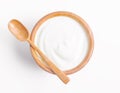 The Fresh greek yogurt in wooden bowl with wooden spoon on white background. Healthy breakfast Royalty Free Stock Photo