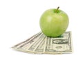 Fresh green apple with money