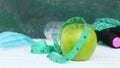 Green apple whit tape measure.