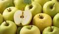Fresh green apples with dewdrops, featuring one halved apple showing seeds, creating a crisp, refreshing fruit composition in a