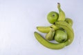 Fresh green apples, pears, bananas on a white wooden background. Concept healthy food photo Royalty Free Stock Photo