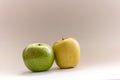 Fresh green apples of two kinds: golden and granny Royalty Free Stock Photo