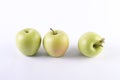 Fresh green apples on a white background. The Three green apples on a white background. Royalty Free Stock Photo