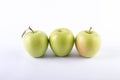 Fresh green apples on a white background. Three green apples on a white background. Royalty Free Stock Photo