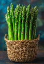 Fresh green asparagus in the basket on wooden table Royalty Free Stock Photo