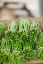 Fresh green asparagus in bundles decorated at the weekly market Royalty Free Stock Photo