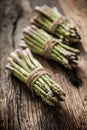 Fresh green asparagus on old oak table Royalty Free Stock Photo