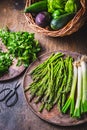 Fresh green asparagus with green onion and herbs on wooden table Royalty Free Stock Photo