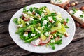 Fresh Green Asparagus salad witch Goat Cheese, peas, radishe, zucchini, lettuce and Hazelnuts. Royalty Free Stock Photo