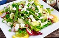 Fresh Green Asparagus salad witch Goat Cheese, peas, radishe, zucchini, lettuce and Hazelnuts. Royalty Free Stock Photo