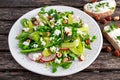 Fresh Green Asparagus salad witch Goat Cheese, peas, radishe, zucchini, lettuce and Hazelnuts. Royalty Free Stock Photo