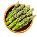 Fresh green asparagus tips in wooden bowl Royalty Free Stock Photo