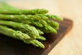 Fresh green asparagus on wooden table