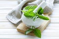 Fresh green basil leaves in a mortar Royalty Free Stock Photo