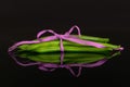 Fresh green bean isolated on black glass