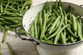 Fresh green beans in colander on white wooden table, closeup Royalty Free Stock Photo