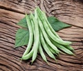 Fresh green beans on the old wood. Royalty Free Stock Photo