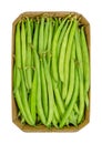 Fresh green beans in a cardboard punnet, unripe fruits of the common bean Royalty Free Stock Photo