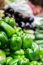 Fresh green bell pepper capsicum on market with Vegetable background. Selling Green Capsicum in local market Royalty Free Stock Photo