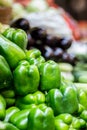 Fresh green bell pepper capsicum on market with Vegetable background. Selling Green Capsicum in local market Royalty Free Stock Photo