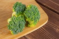 Fresh green broccoli on brown wood Royalty Free Stock Photo