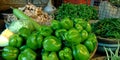 fresh green capsicum isolated on wooden basket at vegetable store Royalty Free Stock Photo