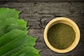 Fresh green chamomile leaves and natural herbal medicine powder Royalty Free Stock Photo