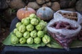 Fresh green chayote, purple yams, pumpkin and ginger on banana leaf at stall vegetable market