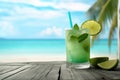 fresh green cocktail on tropical beach AI generated Royalty Free Stock Photo